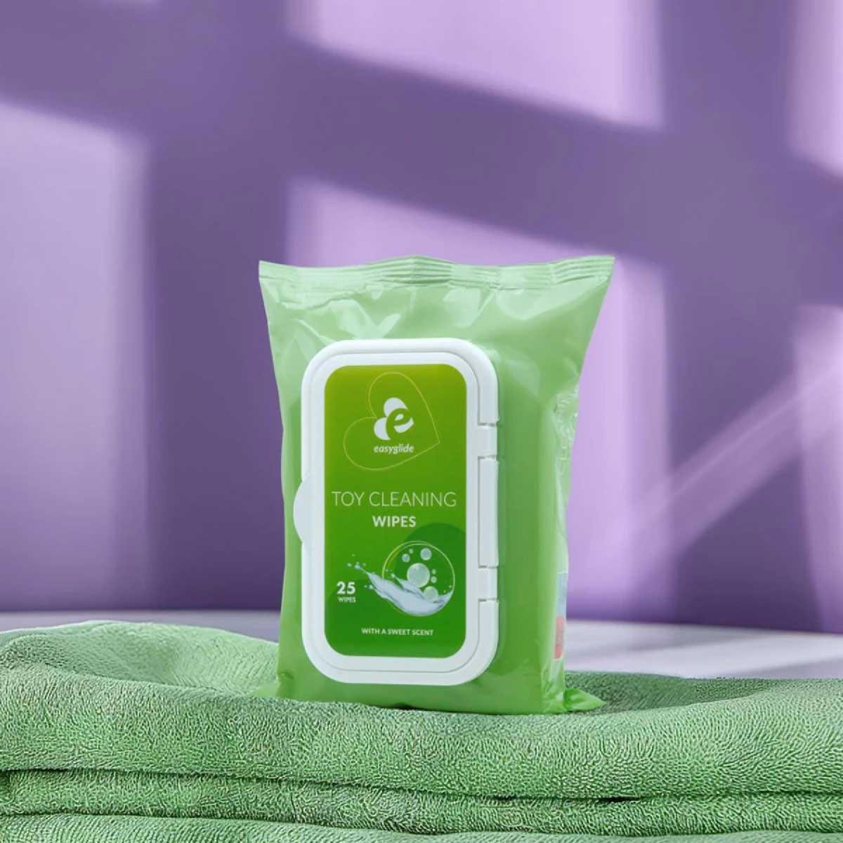 sex toy cleaning wipes on a green towel background